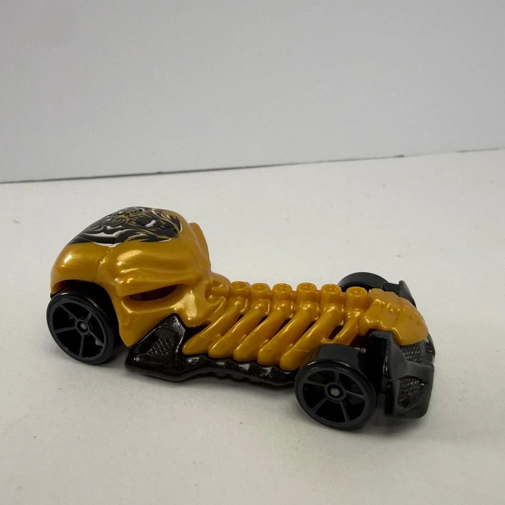 Hot Wheels Skull Crusher 2009 Mattel Gold Black Skeleton Diecast Car 1:64 Scale